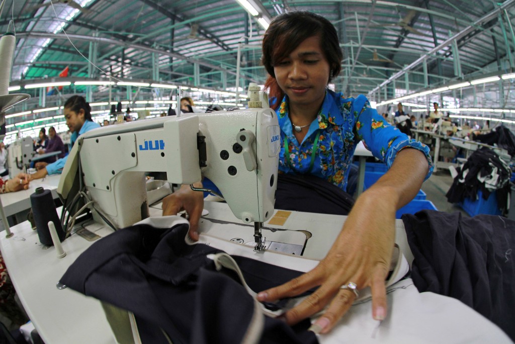 A worker sews a garter to a skirt in a garment factory outside Phnom Penh, Cambodia. Photo by World Bank, Flickr. Licensed under CC BY-NC-ND 2.0.